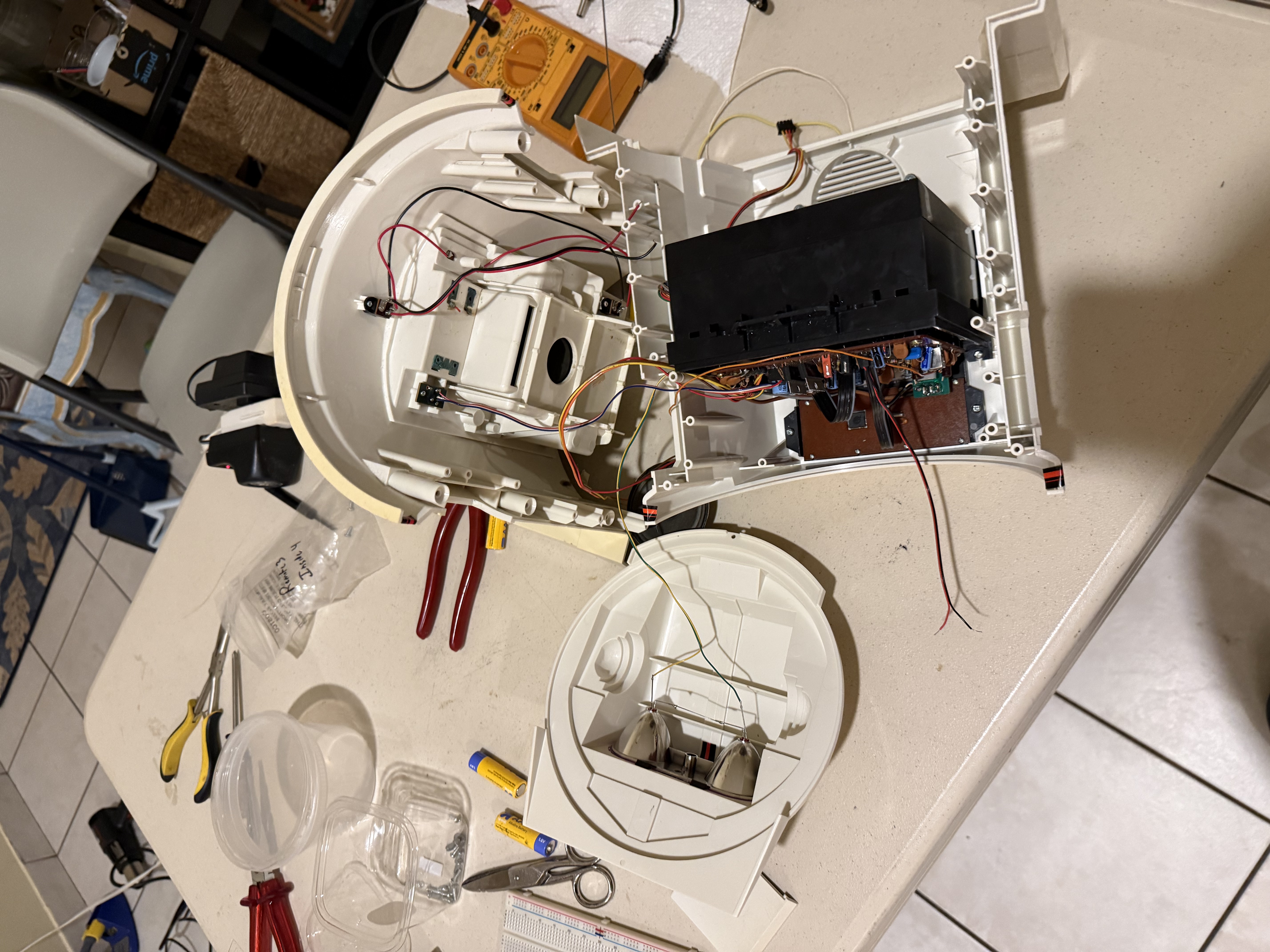 Tomy Omnibot fully disassembled with tools