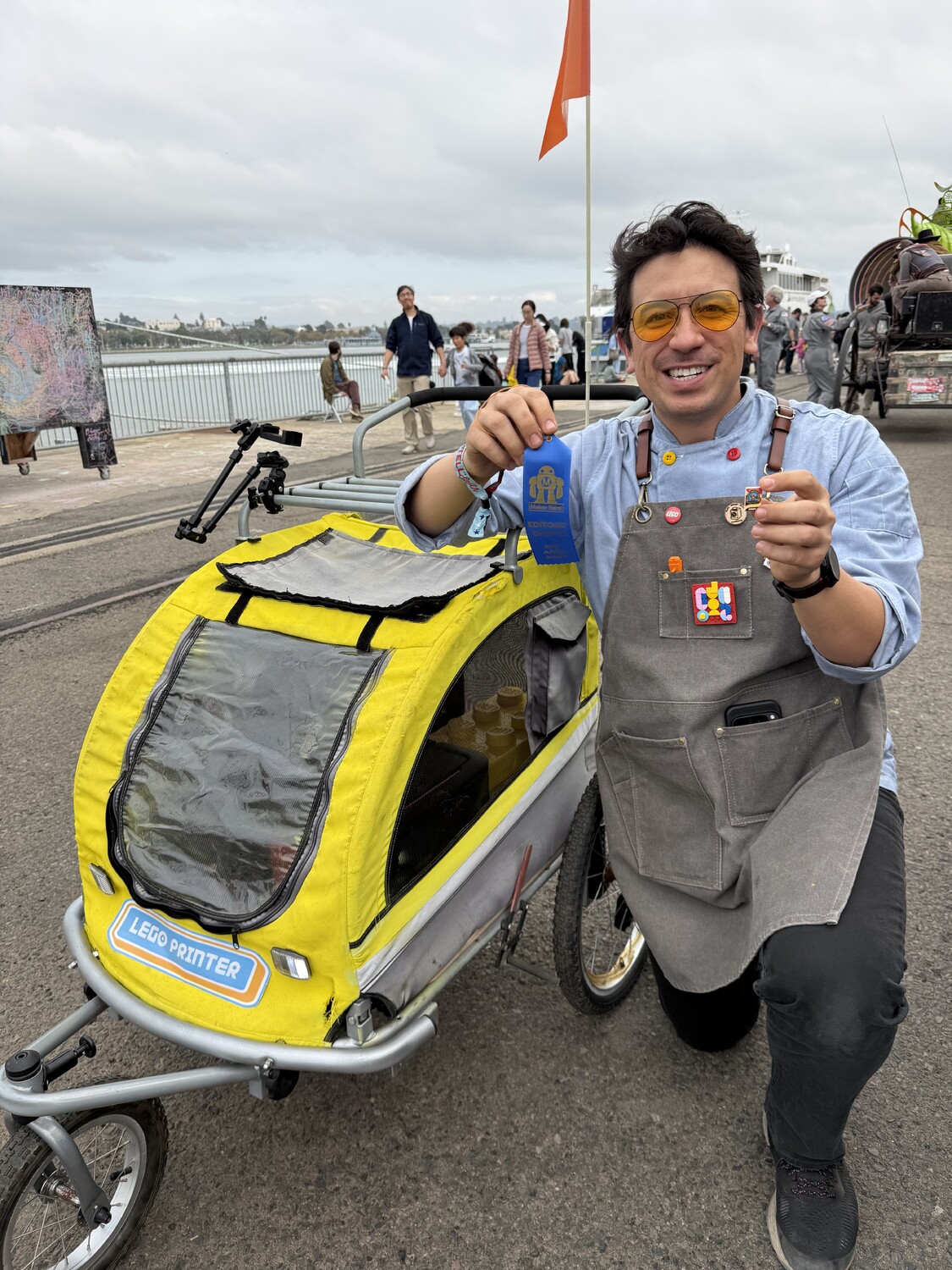 Sam Suksiri with LEGO printer cart