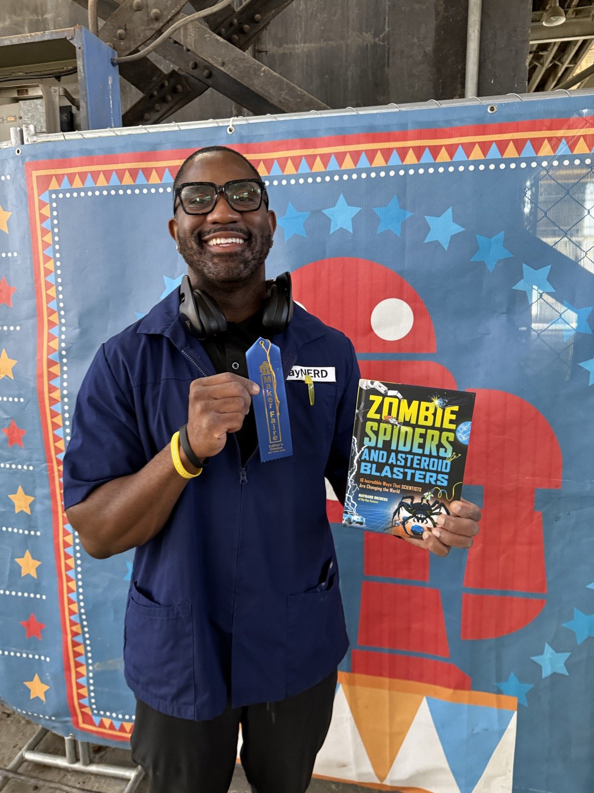 Maynard Okereke with his blue ribbon and his book Zombie Spiders and Asteroid Blasters