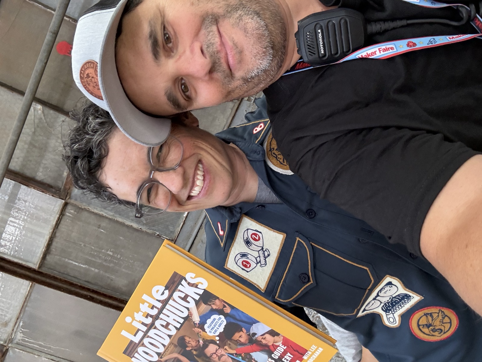 Selfie of Mario Cruz with Lee Buchanan and a copy of Little Woodchucks
