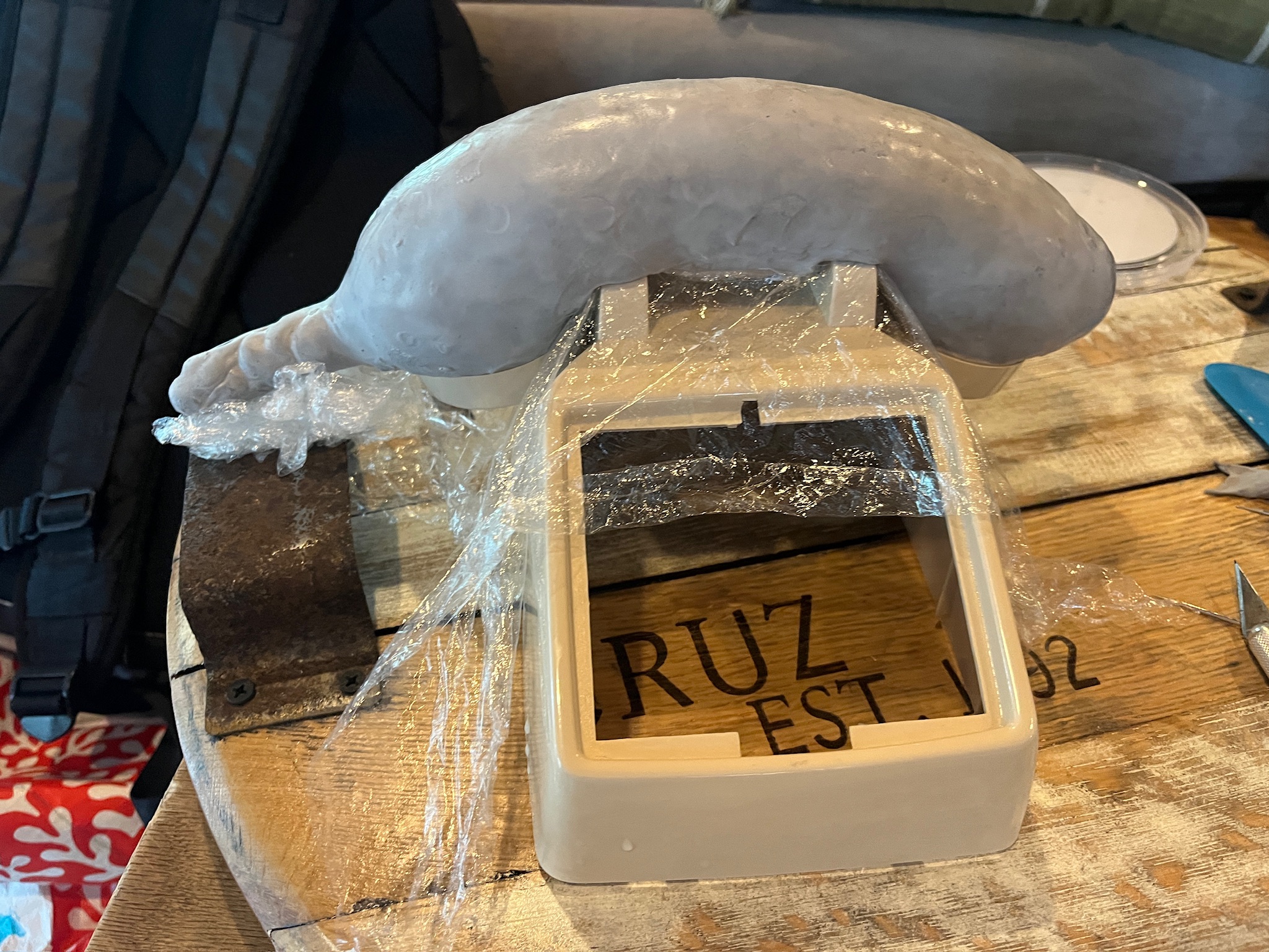 Clay banana handset resting on the phone body