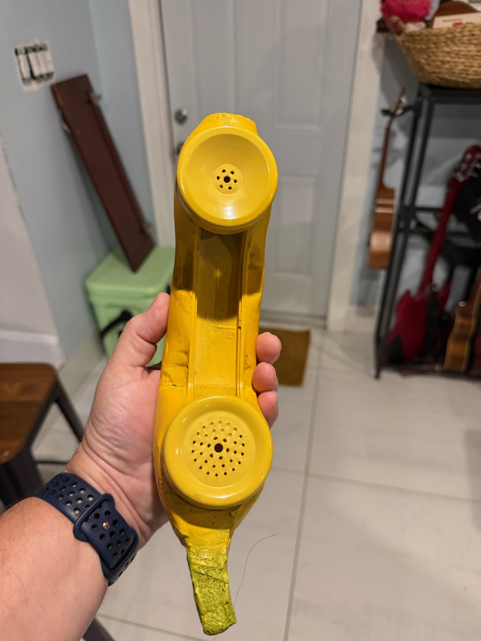 Banana handset underside showing speaker and microphone holes